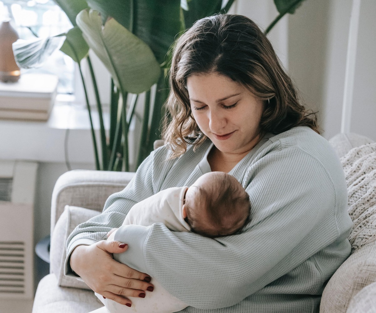 A mom holding a baby